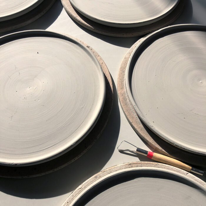 Plates thrown on the pottery wheel